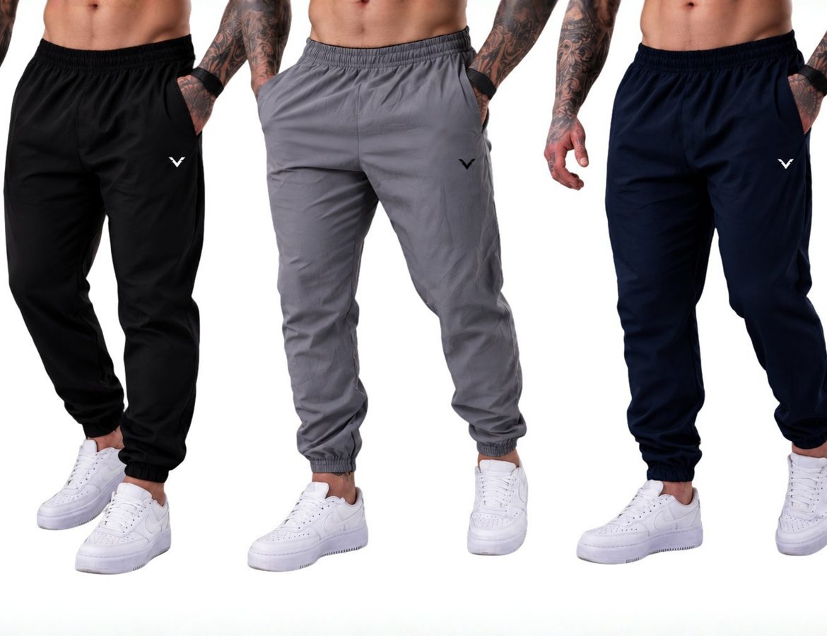 Tres calças jogger de tactel Vankoff, preta, cinza e azul marinho, vestidas por modelos sobre fundo escuro.